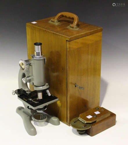 A mid-20th century grey enamelled monocular microscope by Beck of London, No. 35656, Model 47,