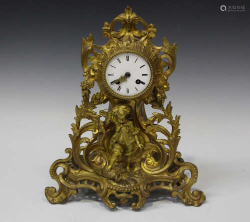 A late 19th century French gilt metal mantel clock with eight day movement striking on a bell via an