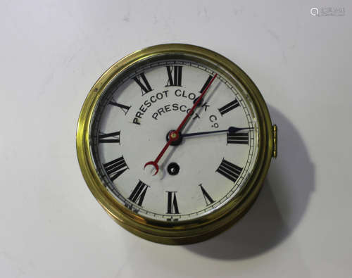 A late Victorian brass circular cased ship's timepiece with eight day chain fusee movement, the