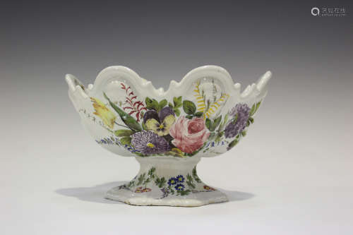A Nove faience monteith shaped centrepiece bowl, circa 1900, botanically painted and raised on a