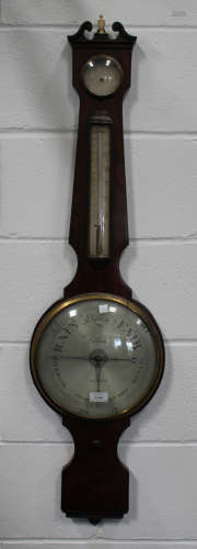 A Regency figured mahogany wheel barometer with mercury thermometer, hygrometer and silvered