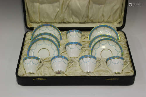 A Mintons set of six coffee cups and saucers, early 20th century, decorated in turquoise