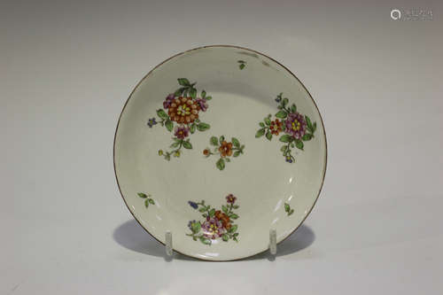 A Continental porcelain saucer, probably Doccia, late 18th century, painted with scattered flower