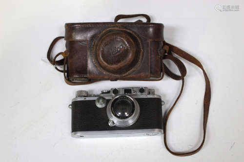A Leica IIIb camera, No. 240704, circa 1937/38, with Summar f=5cm 1:2 lens, No. 298889, leather