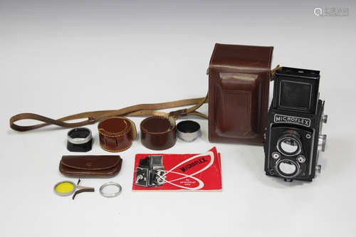 A Micro Precision Products Microflex twin lens reflex camera with leather case and instruction