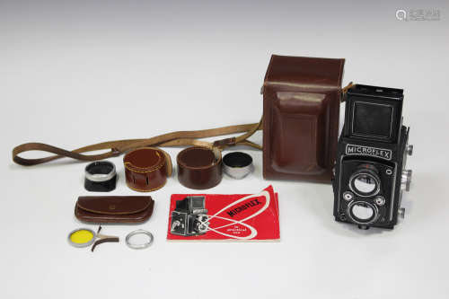 A Micro Precision Products Microflex twin lens reflex camera with leather case and instruction
