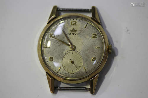 A Marvin 9ct gold circular cased gentleman's wristwatch, the indistinctly signed silvered dial