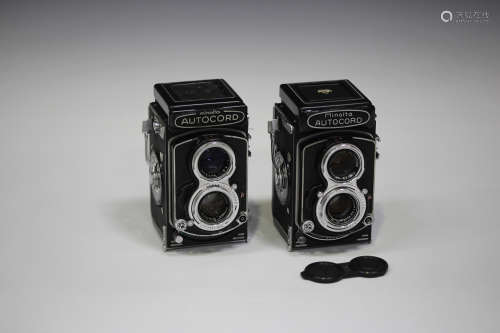 Two Minolta Autocord twin lens reflex cameras, each with Rokkor 1:3.2 f=75mm and 1:3.5 f=75mm