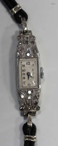 A platinum and diamond lady's dress wristwatch with jewelled lever movement, the silvered dial