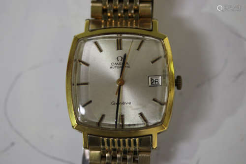 An Omega Automatic gilt metal fronted and steel backed gentleman's bracelet wristwatch, the curved