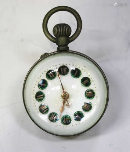 An early 20th century keyless wind plated and magnified glass bullseye desk timepiece, the dial with
