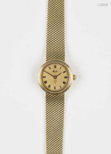 A Mido gold lady's bracelet wristwatch, the signed gilt dial with black Roman numerals, on a