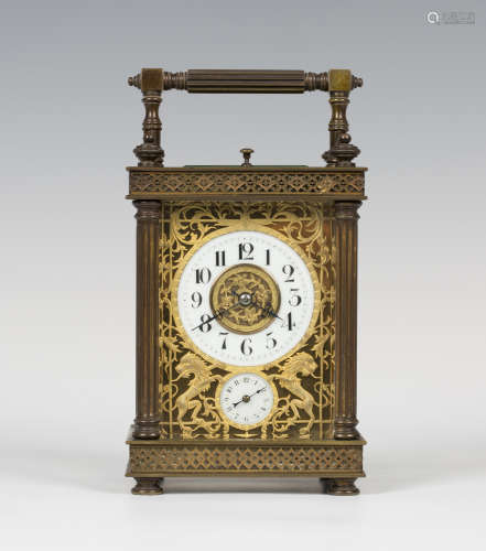 A late 19th/early 20th century French brass cased carriage alarm clock, the eight day movement