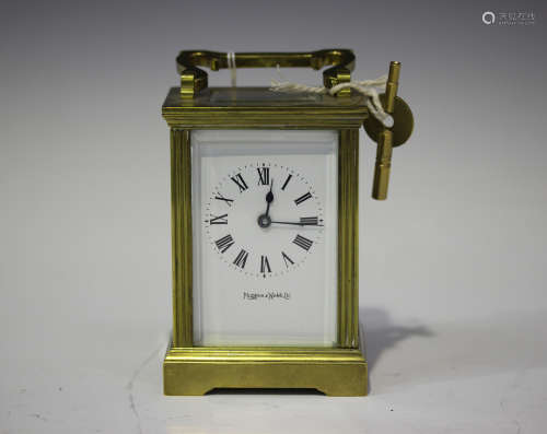 A 20th century brass carriage timepiece, the enamel dial with Roman hour numerals and inscribed '