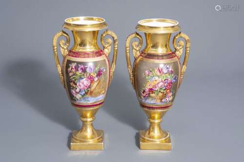 A pair of gilt and polychrome porcelain 'Empire' v...