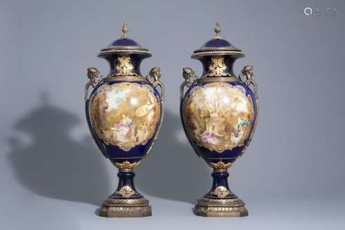 A pair of French gold layered blue ground vases in...