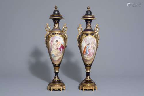 A pair of French gold layered blue ground vases in...