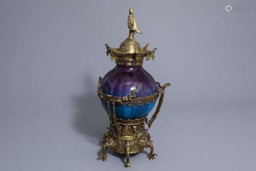 A French flambé glazed vase with gilt bronze chino...