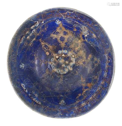 A Lajvardina ware pottery bowl, Iran, 13th-14th century, of conical form on short foot, decorated