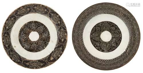 Two Qajar pottery dishes by Mohammed ibn Yusuf, Iran, 19th century, of shallow form, underglaze