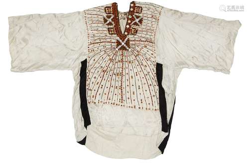 An embroidered silk robe, Egypt, 19th century, of white silk with button and green orange and yellow