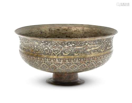 A large Safavid tinned copper bowl, Iran, late 17th century, the bowl rising from a short