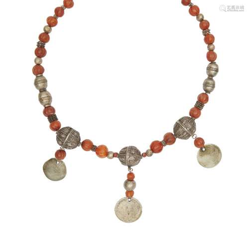 A silver and carnelian bead necklace, Yemen, late 18th-19th century, with silver coin attachments,