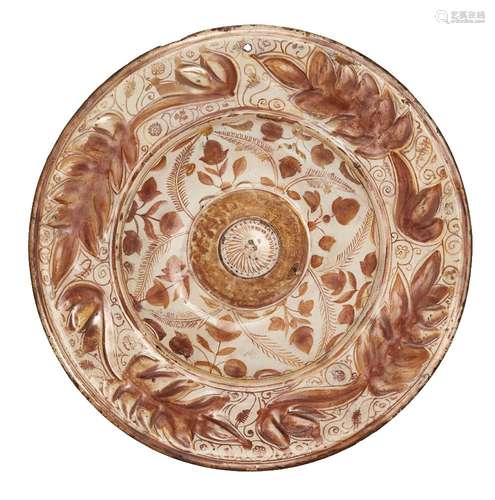 A copper lustre-painted Hispano-Moresque pottery charger, Spain, 18th century, of shallow form, with