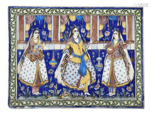 A pair of Qajar underglaze moulded pottery tiles, Iran, 19th century, depicting three dancers and