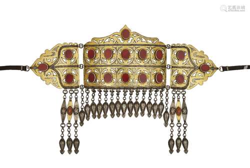 A Tekke parcel gilt silver headpiece, Turkmenistan, 19th/early 20th century, formed of three