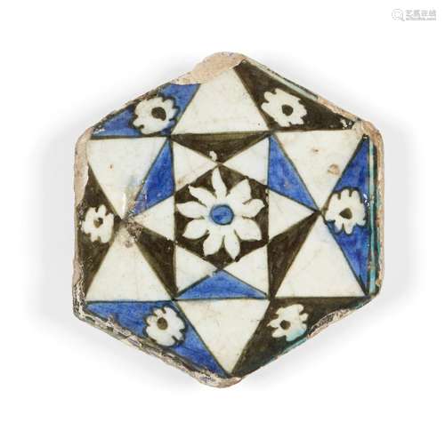 A hexagonal Damascus Iznik tile, 16th century, underglaze painted in black, white and cobalt-blue,