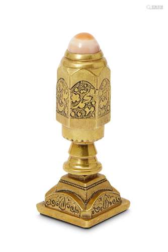 A Qajar inscribed carnelian seal set into an engraved brass stamp with agate knop, Iran, late 19th/