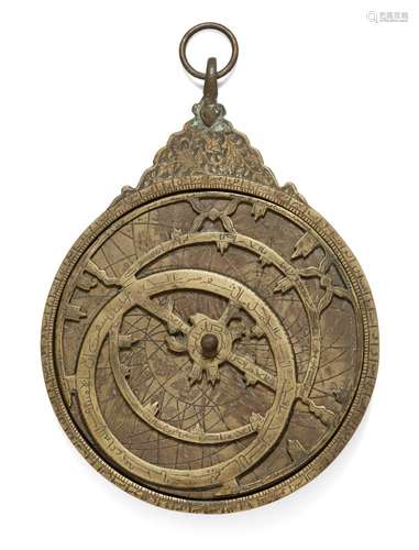 A Qajar decorative brass astrolabe, Iran, 19th century, of characteristic form with a polylobed