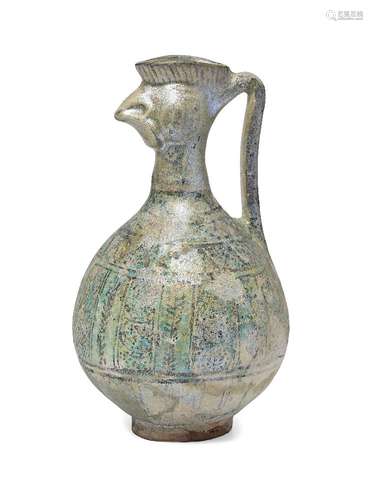 A Seljuk cockerel head pottery jug, Iran, 13th century, the body of squat globular form with