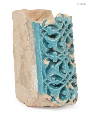 A deeply carved Timurid turquoise tile fragment, Central Asia, late 14th-early 15th century,