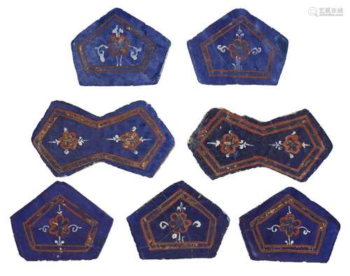 A group of seven gilded Lajvardina tiles, Central Iran, 14th century, comprising two of rhomboid