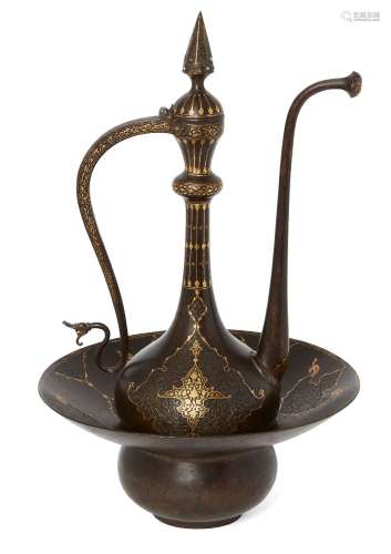 A Qajar damascened and engraved ewer and basin, Iran, 19th century, the ewer on a spreading foot,
