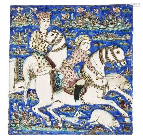 A fine Qajar moulded pottery tile, Iran, circa 1890, underglaze painted in cobalt, turquoise, pink