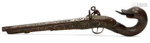 An Ottoman silver wire inlaid pistol with snake and bird head pommel, Turkey, circa 1900, with two-