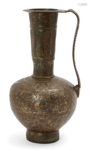 A Khorassan bronze ewer, Iran, 12th century, the compressed globular body on a short straight
