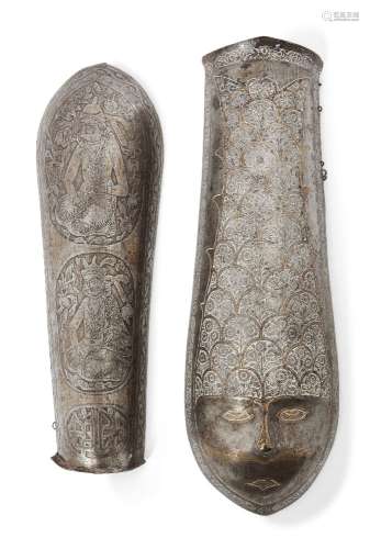 Two Qajar steel bazubands, Iran, late 19th century, with engraved decoration, the first with two