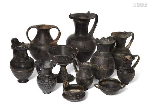 A group of eleven Etruscan bucchero ware vessels, circa 7th-6th Century B.C., comprising a large