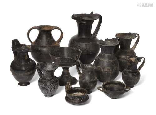 A group of eleven Etruscan bucchero ware vessels, circa 7th-6th Century B.C., comprising a large