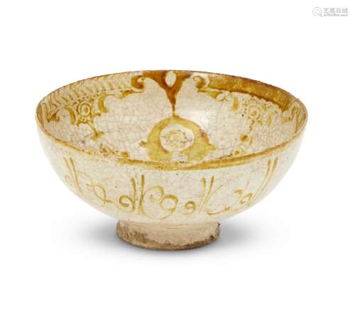 An intact Kashan lustre-painted bowl, Iran, circa 1170-1200AD, of deep form with rounded sides, on