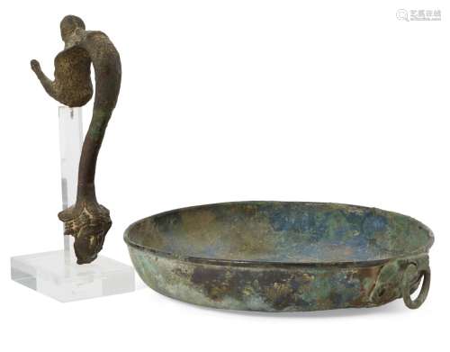 A Roman bronze dish with lion mask handle, 21.3cm maximum diam., and Roman bronze handle, a siren