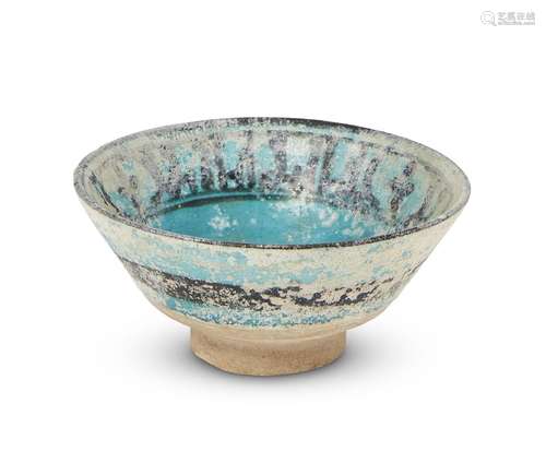 A small intact Kashan pottery bowl, Iran, 12th century, of conical form, decorated to interior in