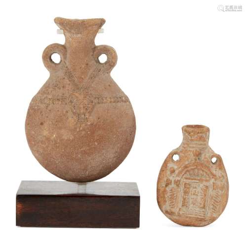 Two pottery flasks, including a vessel with two small handles, the swollen body with relief