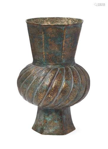 An engraved brass vase, North Iran, 16th-17th century, with faceted neck, base and turban-shaped