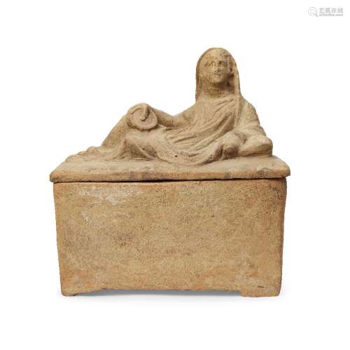 An Etruscan terracotta cinerary urn and lid, circa 3rd-1st Century B.C., the lid in the form of