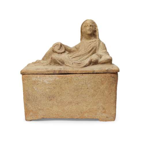 An Etruscan terracotta cinerary urn and lid, circa 3rd-1st Century B.C., the lid in the form of